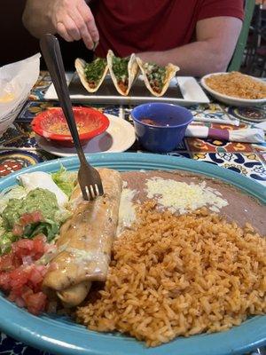 Yummy chimichanga ! Pastor tacos across the table !