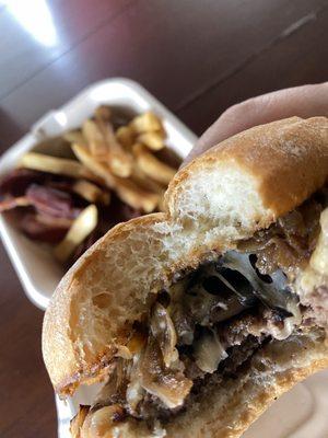 Fun guy mushroom burger with fries and bacon on the side.