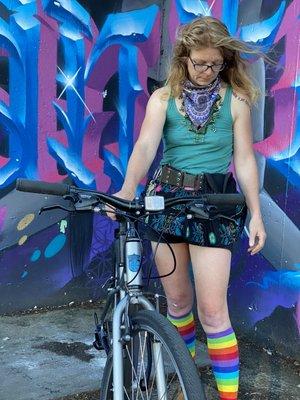 Sarah co-owner modeling a Kona bicycle