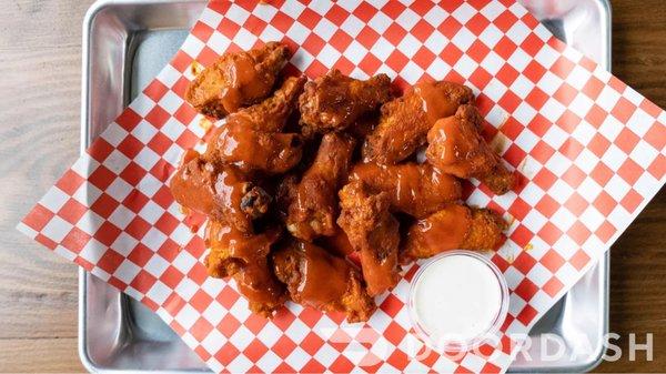 Buffalo Wings! Available in 10pc & 20pc (flavor option: Buffalo, Sweet Sriracha, Mango Habanero)