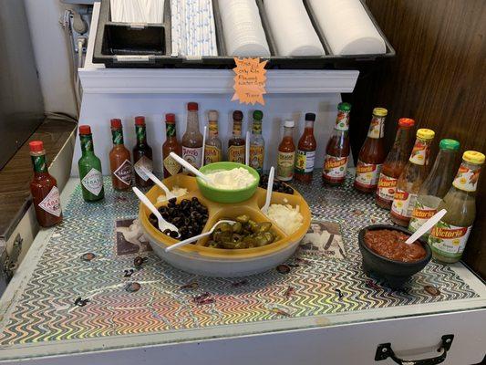 Practice safe lunch- use condiments!...Hot sauce bar