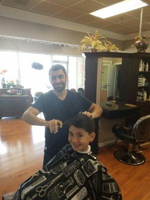 Sam cutting my son's hair