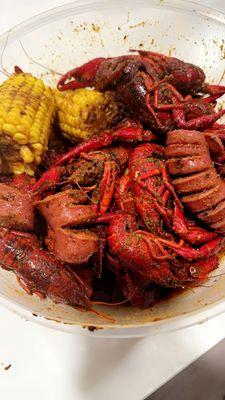 The Shorewolf boil - Crawfish, corn, sausage "link", potato. Lemon pepper n garlic seasoning medium heat.