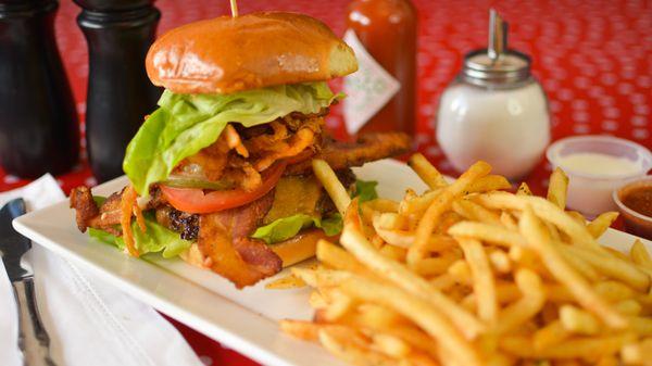 BOMB BURGER | 1/2 LB PATTY(WELL-DONE), CHEDDAR CHEESE, BACON, FRIED ONION CRISPS, TOMATO, LETTUCE, & CHIPOTLE AIOLI ALL ON A BRIOCHE.