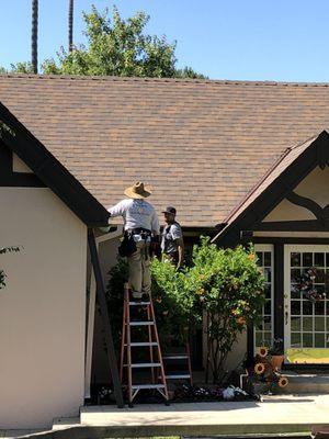 Installing gutters over the front entry of a home in Pasadena