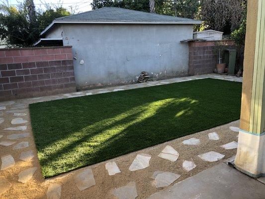 Owner wanted a low maintenance backyard and what could be better for that than some DG and artificial turf.