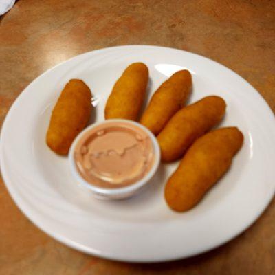 Sorullitos (Puerto Rican style corn fritters/corn sticks) served with mayo-ketchup