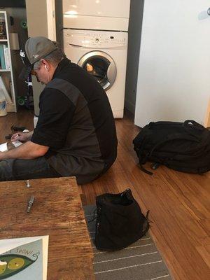 Jason hard at work sourcing parts for our broken washer.  He is amazing!  Highly HIGHLY recommend this service tech and this company.