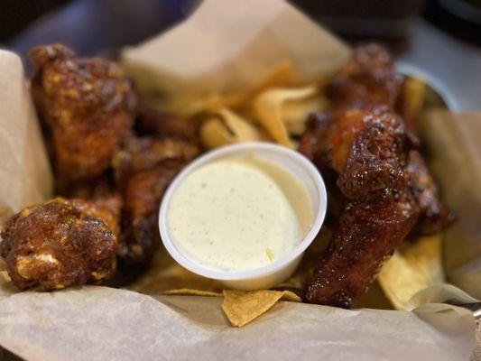 Chicken wings with. Garlic buffalo and huckleberry bbq sauce