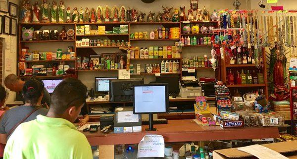 A little bit of everything behind the checkout counter of the store entrance