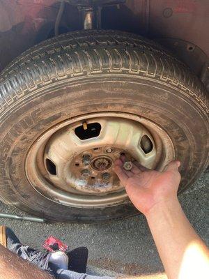 Flat tire I replaced myself but it had two missing lug nuts (one was stripped) and a broken wheel stud