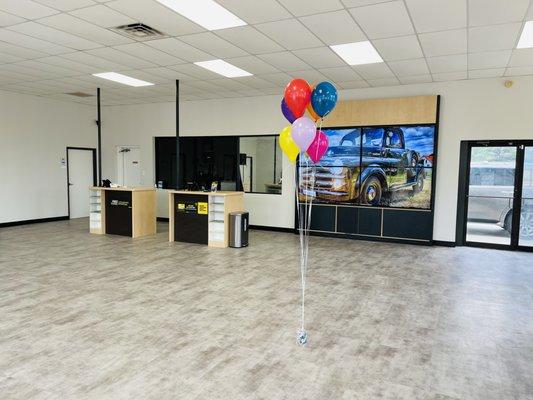 Reception room with large screen TVs.