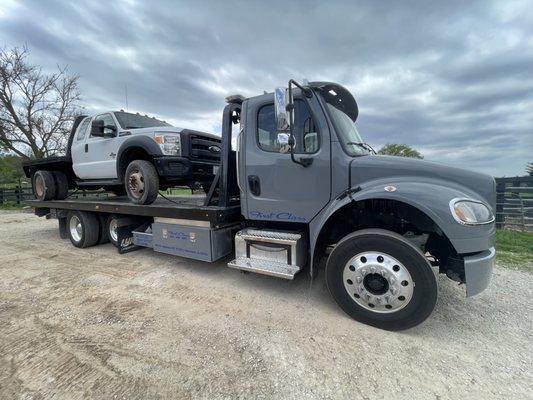 Our industrial carrier towing a commercial vehicle.