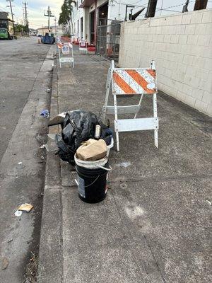 Filthy buckets and more garbage. Left for someone else to clean up