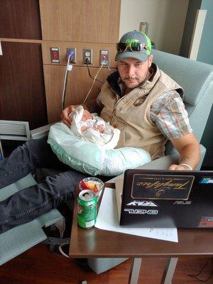 Father of the Year multi-tasking in the amazing birthing suites!