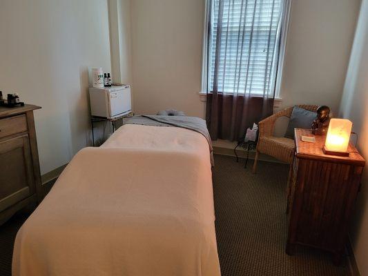 Massage room with heated table, highest quality lotions & equipment.