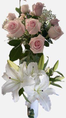 One bouquet of pink roses and white lilies split into two vases