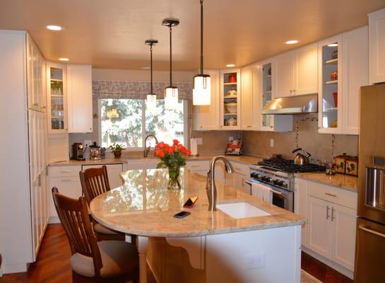 Light and bright and comfortably functional, this U-shaped kitchen remodel shows off its best assets.