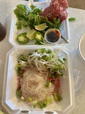 With tax. $22. Large beef pho two spring rolls two fried rolls. Sauce is perfect. Tons of meat. Tons of sprouts and herbs. Amazing.