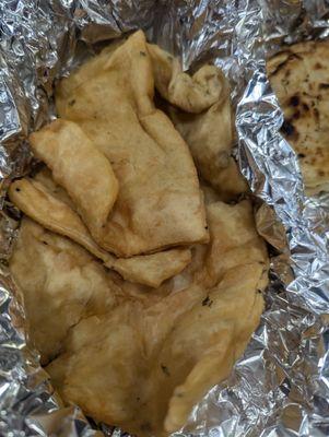 Bhatura, would probably be better fresh but this is a take out restaurant so the quality suffers.