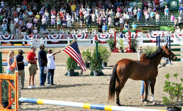 Clients of Alpha Omega Veterans Services leading horses at the Germantown Charity Horse Show with Southern Reins Center for Equine Therapy