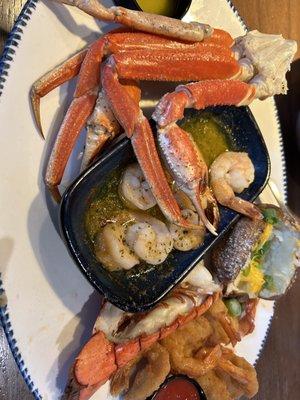 Wild-caught Snow Crab Legs, Garlic Shrimp Scampi, Baked Potato