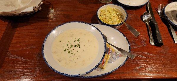 Bowl of clam chowder with cole slaw that got subbed in for salad they were out of that day. Good tang, but not vinegar bite, on the slaw.