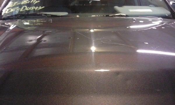 As you can see there are a lot of large dents on this hood, But that is not a problem at All American Hail Repair....