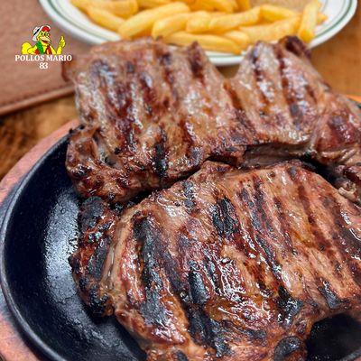 Succulent grilled meat cuts, seared by a slow flame and seasoned to perfection. Come to Pollos Mario 83 and savor the taste of traditio