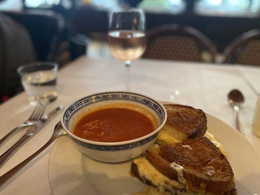 Grilled cheese sandwich and tomato soup and a chilled glass of rosé wine.