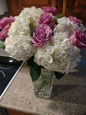 Simple but elegant. White hydrangeas with purple roses. I wanted peonies, but they are out of season.