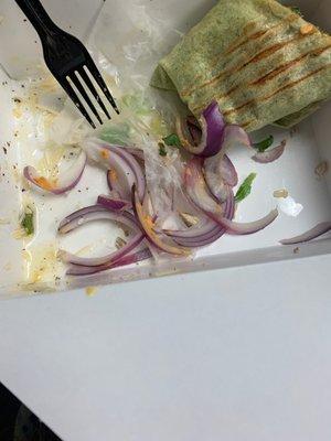 Lots of red onions from chicken hummus wrap.