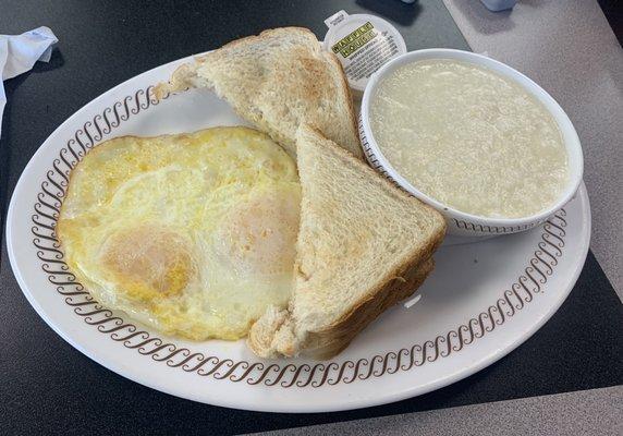 Two eggs over easy, grits, toast