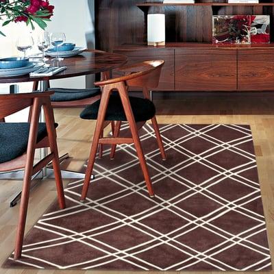 Clean and simple, this decorative rug fills a void missing in this room.