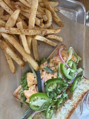 Bangbang shrimp sandwich with fries.