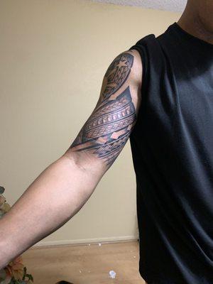 Filipino sun and stars with poly tribal tattoo