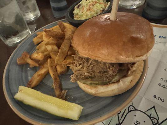 Pulled pork sandwich, with a soft pickle and coleslaw that screamed "Vinegar!"