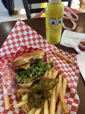 Cheeseburger with fries and jalapeños and pepper on my fries.