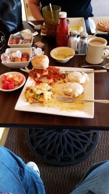 Cajun omlete with smothered pot, biscuit and gravy with fruit.  Coffer and water.   This was delicious !!!