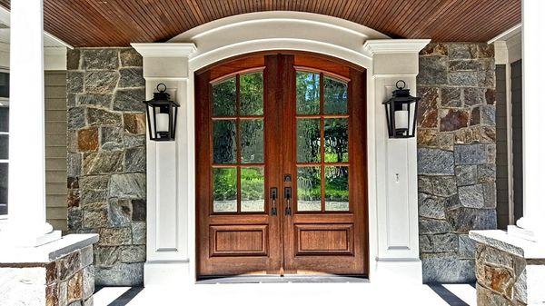 Wood Front Door Arched opening and columns.