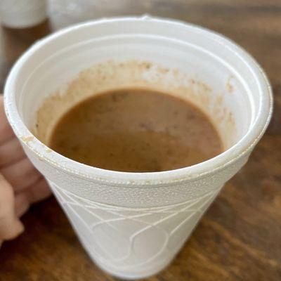 Free sample of atole, a thick, spiced, warm chocolate drink thickened with corn masa