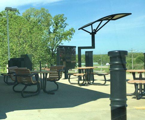 Outside seating area next to the drive-thru lane.