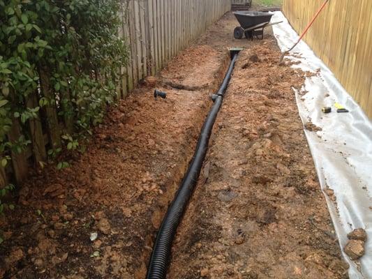 French drain installed for rock walk way