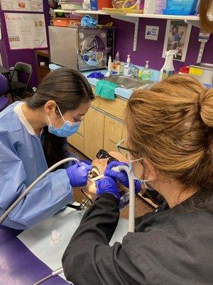 Student learn how to use the suction tip equipment.