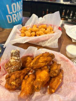 Garlic Parm and Buffalo chicken wings.  Breaded, extra crispy.  Tots.