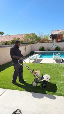 Artificial turf cleaning