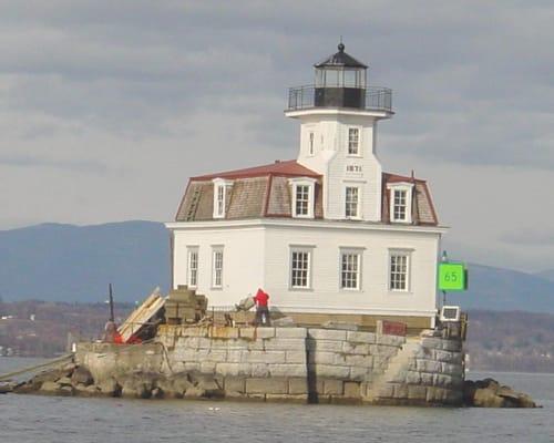 Lighthouse constructed on a man made granite pylon / island to mark the channel at the center of the Hudson River...