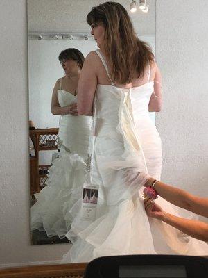 the wedding dress was very big for her, now we executive tailors will fix to her satisfaction