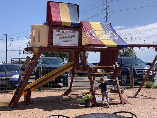 Play structure. There was a heavy rain last night so there is still a bit of water standing. Bring extra clothes.