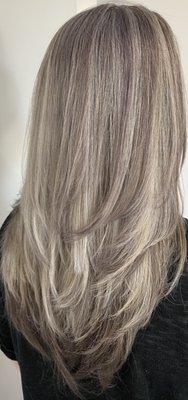 Soft cool lowlights and highlights.  Long layers give texture and show off the haircut and color.